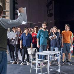 Cast members rehearsing a scene of UVA Department of Drama's production of URINETOWN. Photo by Michael Bailey.